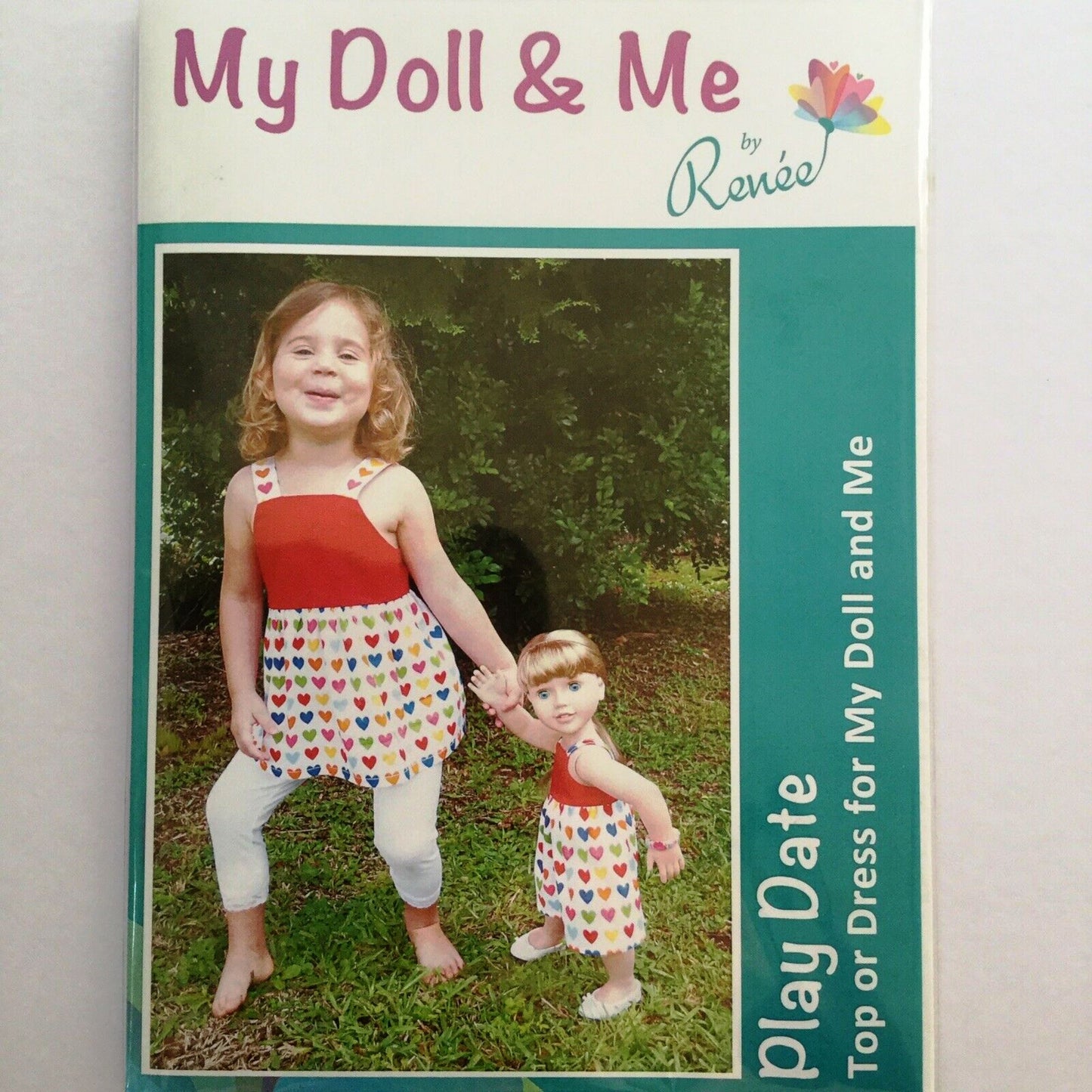 Child's top or dress sizes 2-8 and doll dress pattern with hanger
